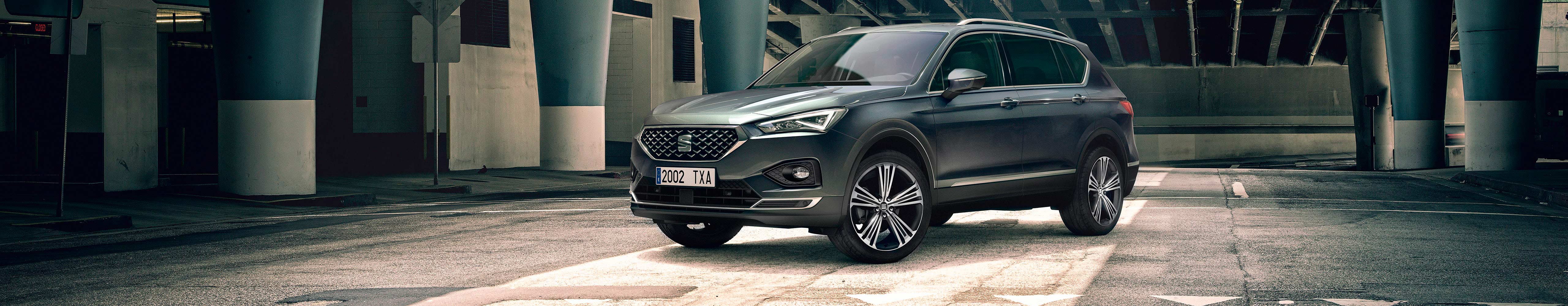 New SEAT Tarraco SUV 7 seater parked outside building beauty shot