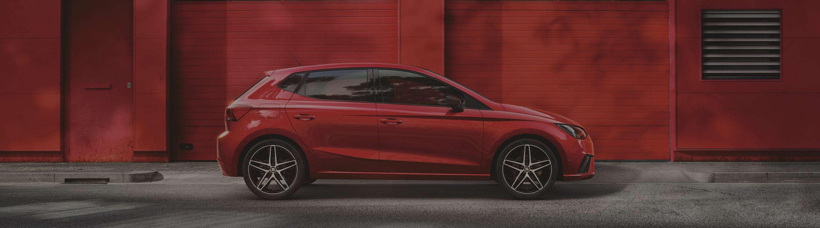 SEAT Ibiza desire red side view